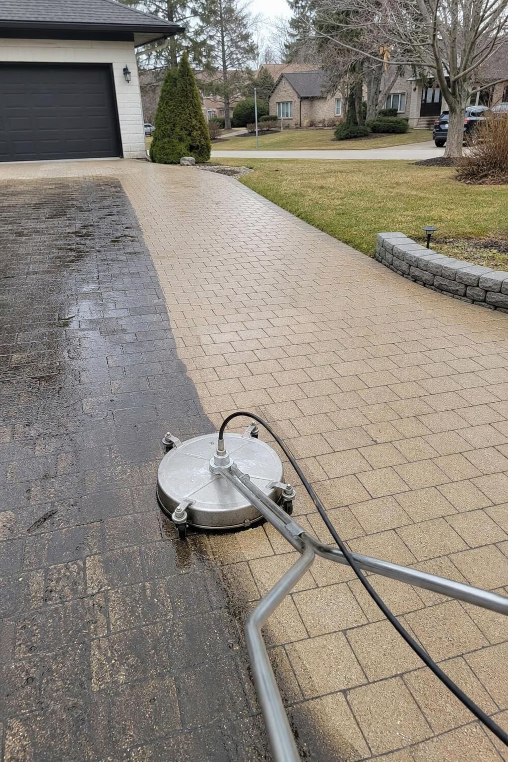 Surface cleaner on a half-cleaned driveway